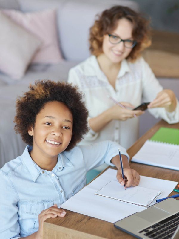 radiate-happiness-happy-mixed-race-teen-schoolgirl-smiling-at-camera-while-having-a-lesson-with-qdav5yzph4r4wgs1rg7ghehbni1spckxer950dar7k